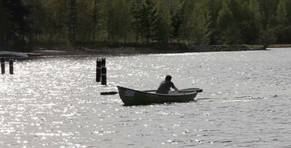 Rowing Boat Floats On The Lake