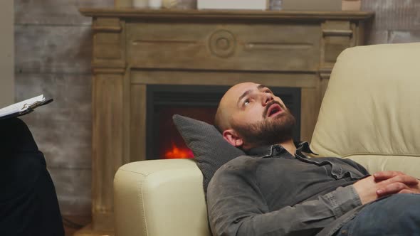 Close Up of Young Man Laying on Couch