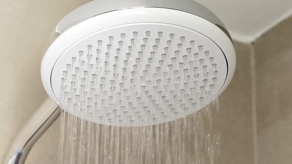 Shower in Hotel Bathroom. Dripping Drops