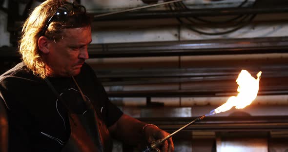 Welder burning welding torch