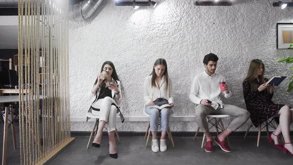 Jobless Applicants Group Sitting in Queue Waiting for Job Interview