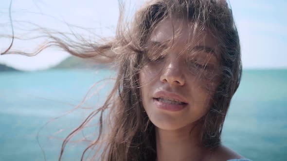 Close Up Portrait of Beautiful Young Woman Hair Blowing in Wind on the Villa Slow Motion