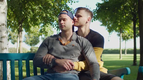 Lovely Same-sex Partners Bonding on Park Bench