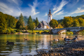 Scenic view of Lake Bohinj church with beautiful colorful foliage, Slovenia - PhotoDune Item for Sale