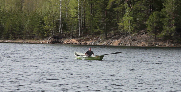 Rowing Boat Floats On The Lake