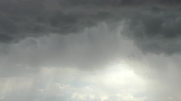 Low angle time-lapse of moving clouds and changing weather alt