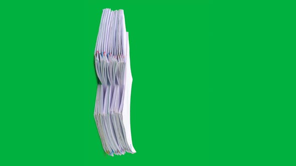 Stop motion animation Stacks overload document paper files on chroma key green screen background.