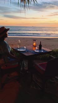 Women Having Dinner on the Beach in Thailand Luxuryromantic Dinner with Candle Light During Sunset