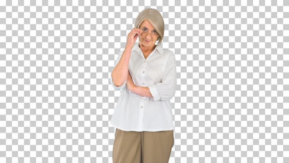 Elderly woman standing with crossed hands, Alpha Channel