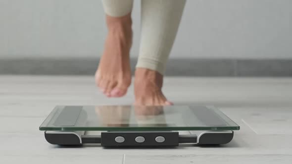 Woman Measuring Weight