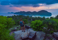 Female Backpacker admires beautiful landscape of the Ko Phi Phi  after sunset, Thailand - PhotoDune Item for Sale