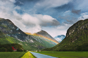  Park, Norway. Beautiful Sky After Rain With Rainbow Above Norwegian Rural Landscape. Agricultural And Weather Forecast Concept.