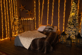 Cozy christmas bed with decor and lamps - PhotoDune Item for Sale