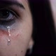 Close-up of the eye of a young female victim of domestic violence.  - VideoHive Item for Sale