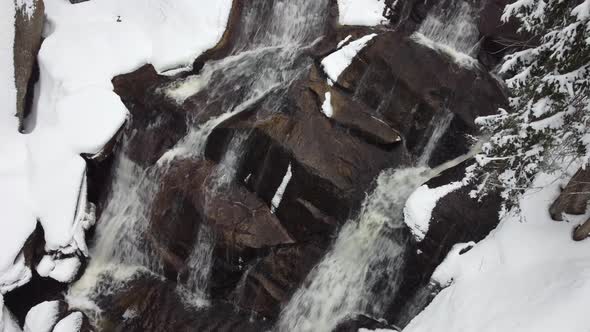 Aerial shot of a winter waterfall