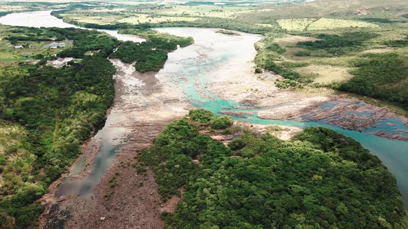 Cinematic drone footage - flying sideways over the river showing a mountains at minas gerais in Braz