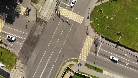 Time Lapse Aerial View of Road Junction in City with Cars. Intersection in Small Town