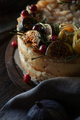 Cheesecake with physalis and dates on a wooden stand - PhotoDune Item for Sale