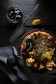 Cheesecake with dates and physalis on a stand with a napkin - PhotoDune Item for Sale
