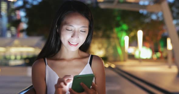 Woman use of smart phone in the city