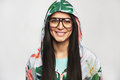 Pretty cheerful female model posing in hood and glasses - PhotoDune Item for Sale