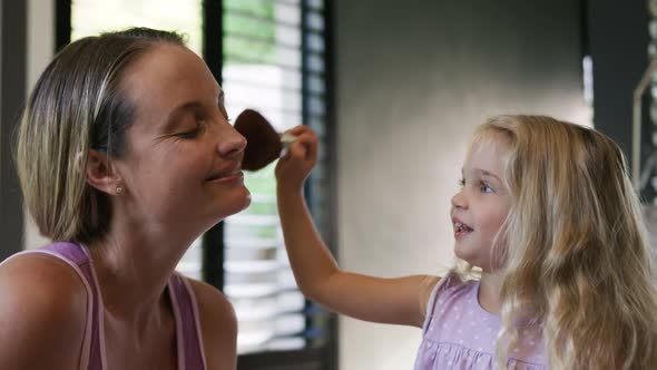 Daughter making up her mother