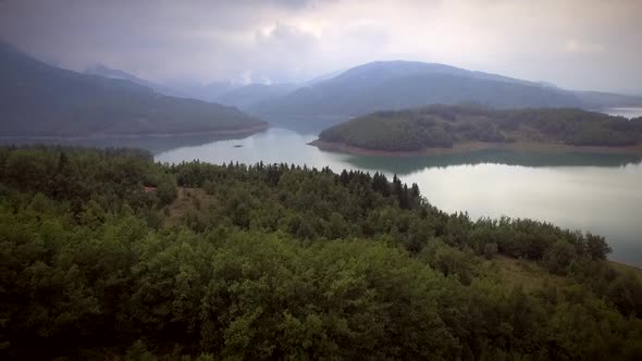 Aerial view of the beautiful Plastiras Lake on a cloudy day in Greece.
