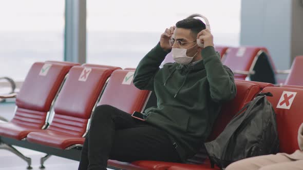 Man In Headphones At Departure Lounge