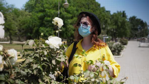 Girl Observes Modern Precautions and Wears Medical Mask To Protect Him From Infection and Enjoys