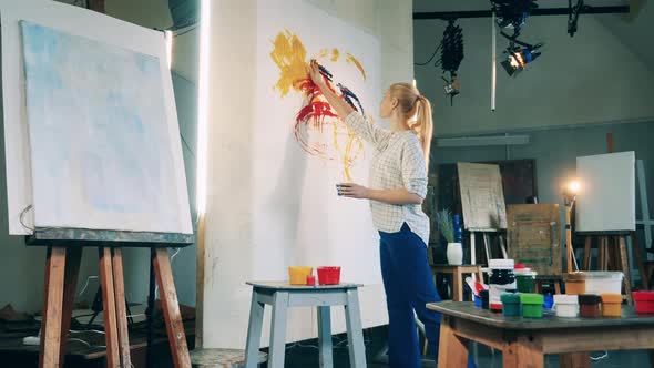 Abstract Painting is Being Created By a Lady Artist