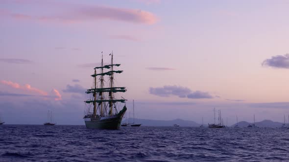 Sailing Ship with Folded Sails Is Floating in Mediterranean Sea. Lipari Islands, Sicily, Italy