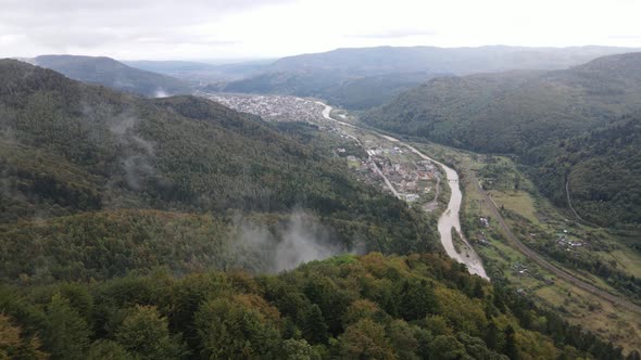 Village in the Carpathian Mountains in Autumn. Slow Motion, Aerial View