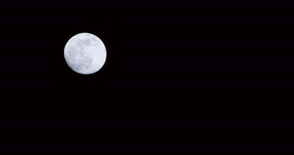 Full moon at night. Moving through the screen bottom to top. nighttime. Austria