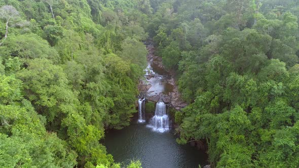 Flying over Jungle with Waterfall