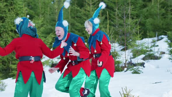 Three elves laughing and having fun