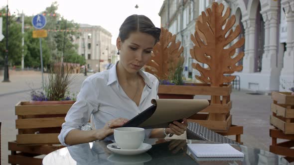 Elegant Businesswoman Calling for Waiter While Sitting at Coffee Shop, Business Lunch Break of