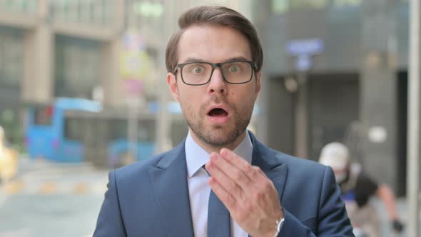 Portrait of Businessman Feeling Shocked, Surprised, Outdoor