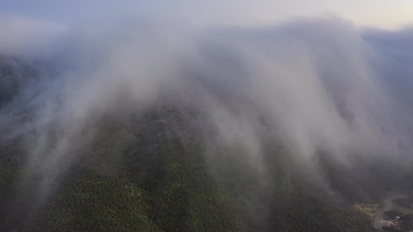 Time Lapse Scenic Cloudfall Over Green Mountains