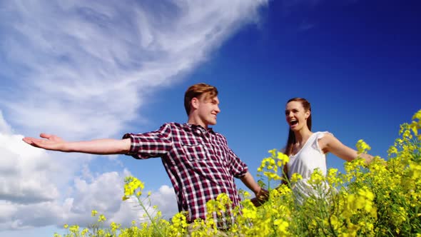 Romantic couple having fun in field