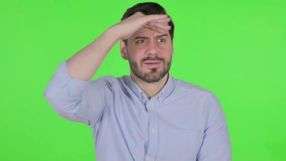 Portrait of Man Looking Around Searching Green Screen