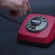 Close-up view of old red rotary phone - VideoHive Item for Sale