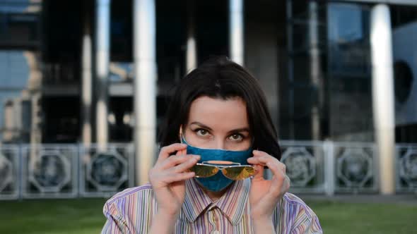 Young Brunette Girl in Protective Mask