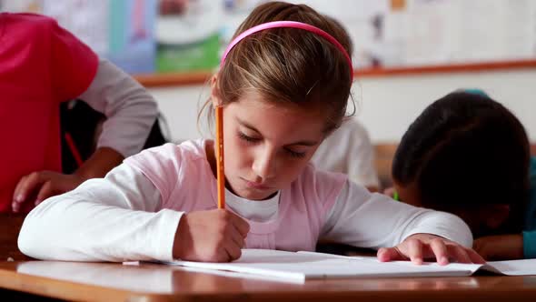 Little Girl Colouring in the Classroom