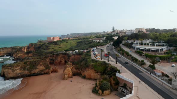 Amazing Aerial Drone View of Portuguese Coastline Drone Flying Sideway Above Road in Lagos Reveal