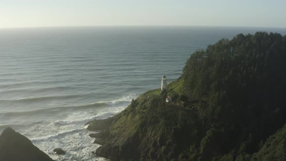 Right to left tracking aerial of Haceta Head lighthouse in Oregon