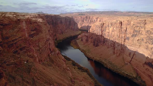 Aerial Flight in the Deep Beautiful Red Canyon with Sheer Red Sandstone Cliff Walls Near Glen Canyon