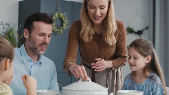 Caucasian family about to start an easter dinner at home. Shot with RED helium camera in 8K.