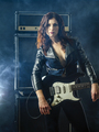 Beautiful woman with red hair holding electric guitar - PhotoDune Item for Sale