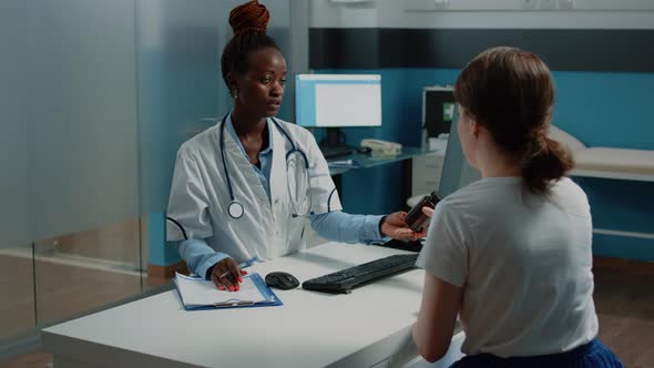 Medic Giving Bottle of Pills to Patient with Sickness at Checkup