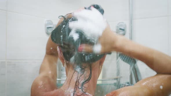 Woman in the Shower Showering Under Refreshing Water